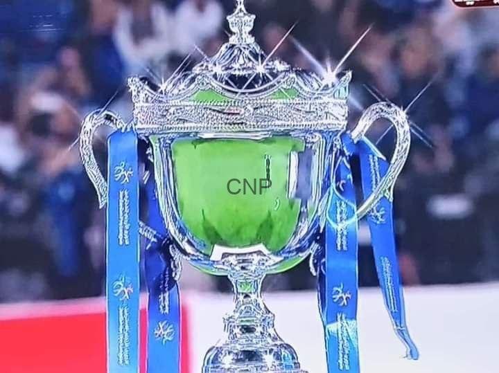 cfi - Center News Network Silver trophy with blue ribbons and a green cup, labeled CNP, on a sports stage.