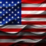 Waving United States flag with red and white stripes and white stars on a blue field