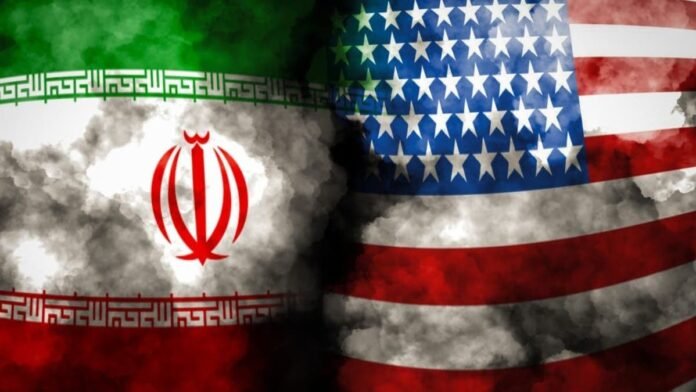 Overlapping Iranian and American flags with dark smoke between them, symbolizing tension between the two nations.