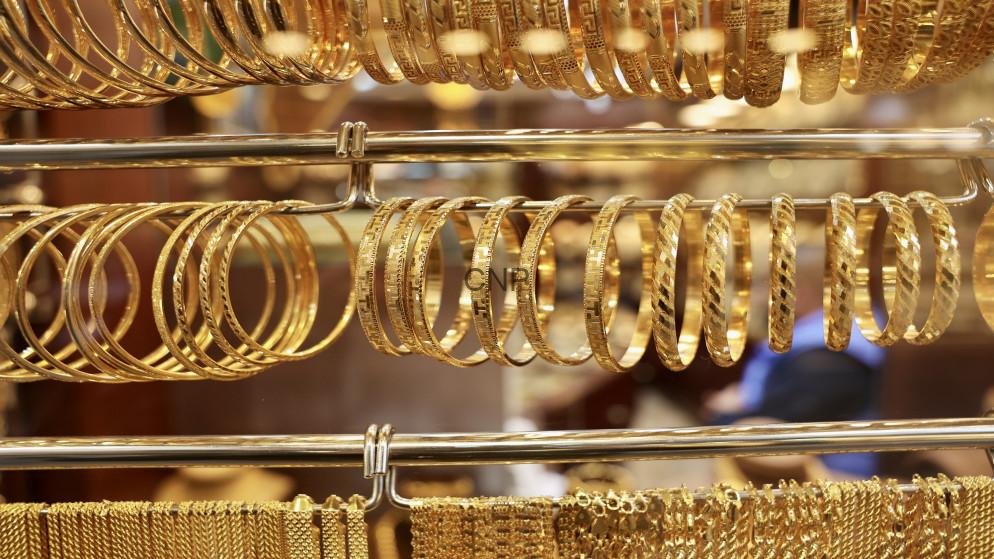 69c4f356365ff - Center News Network Rows of gold bangles and bracelets on display in a jewelry shop