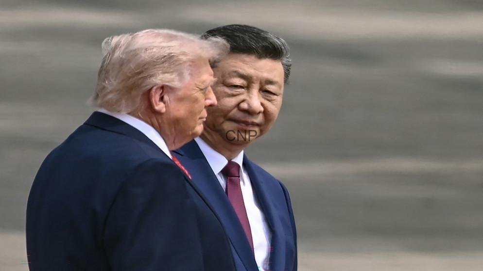 - Center News Network Two men in dark suits stand side by side on an airstrip, engaged in conversation as they walk away from camera.