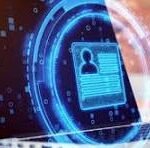 Laptop with a glowing blue digital lock and shield, symbolizing cybersecurity and data protection.