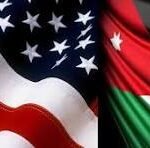 Close-up of two national flags, the United States flag on the left and the Kenyan flag on the right, overlapping.