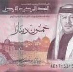 Front of a Saudi Arabian banknote with a portrait of a king in traditional attire and Arabic script, predominantly pink/purple tones.