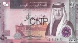 money - Center News Network Front of a Saudi Arabian banknote with a portrait of a king in traditional attire and Arabic script, predominantly pink/purple tones.