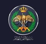 amen - Center News Network Official emblem featuring a crowned double-headed eagle within a green circular shield, flanked by laurel branches and crossed swords, with Arabic script beneath on a dark background.