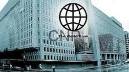 Exterior view of The World Bank headquarters with its globe logo overlay on the building’s facade.