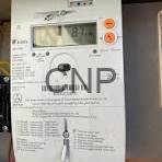 kahr - Center News Network Close-up of a white electronic control panel with a digital display and orange buttons, labeled CNP.