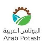 Arab Potash logo featuring a brown gear, blue water wave and green leaf with the name 'Arab Potash' in English and Arabic