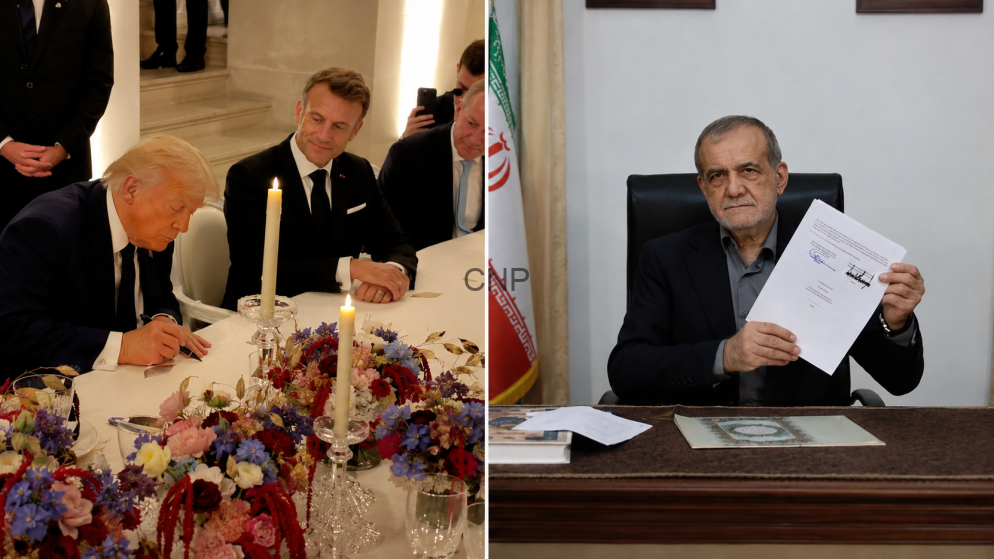 sign - Center News Network Two men in suits sign a document at a formal signing table with candles and a flower centerpiece on the table.