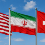 Three national flags—United States, Iran, and Switzerland—flying on flagpoles against a blue sky with scattered clouds go by in the wind?