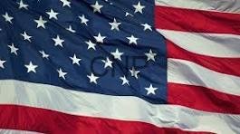 usf - Center News Network Waving United States flag with visible stars and red-and-white stripes, fluttering in the breeze.