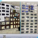 Police seizure display: firearms, bags of pills, powders, cash, and packaging laid out on tables for evidence.