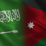Composite flag image blending Saudi Arabia's green flag with the Jordanian flag (red triangle and white star) in a seamless merge.