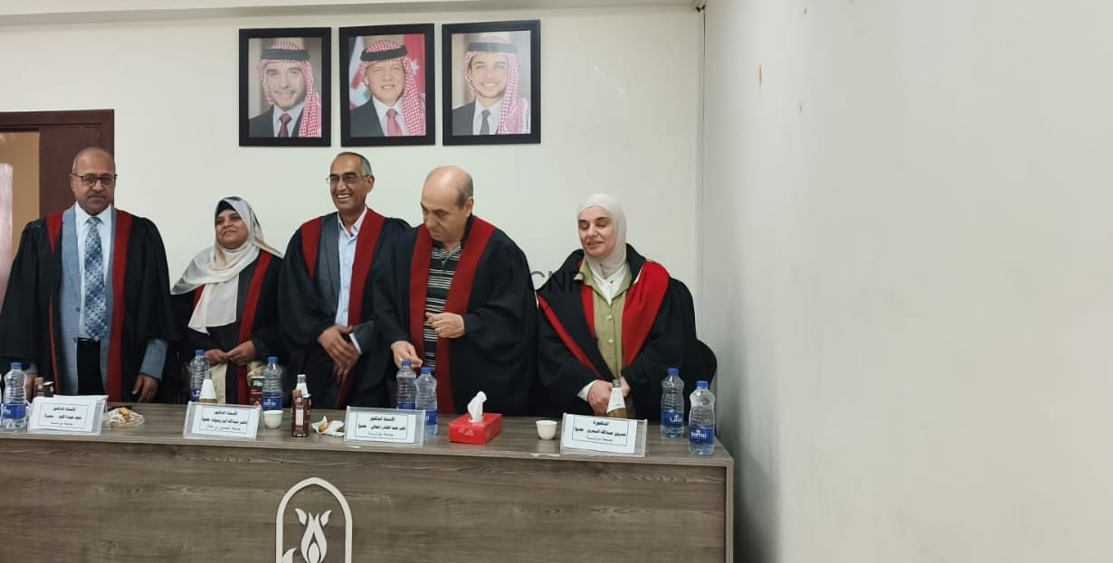 image - Center News Network Five academics in black robes with red trim stand behind a conference table during a formal ceremony; portraits hang on the wall behind them.